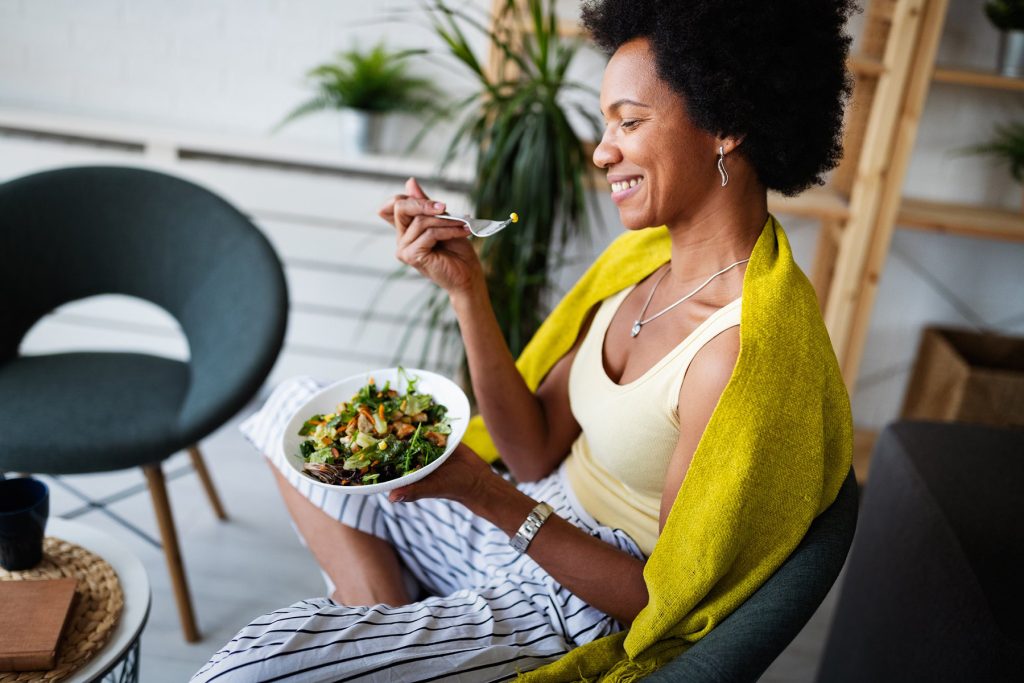 woman eating salad
