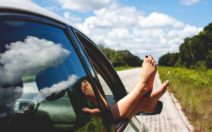 feet hanging out car window